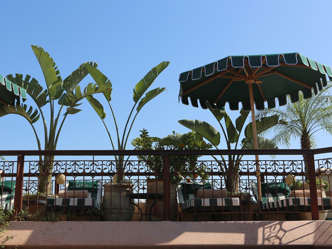 riad livia terrace rooftop with view tables and daybed