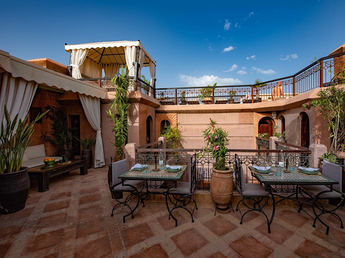 riad livia terrace rooftop with view tables and daybed