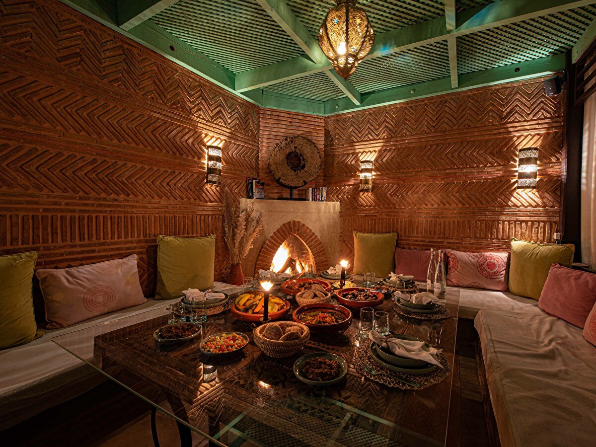 riad livia fireplace rooftop terrace seating area